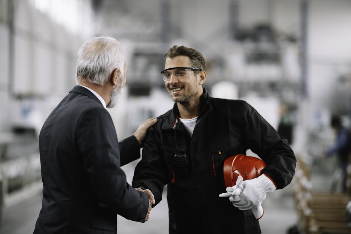 Colleagues working together in factory