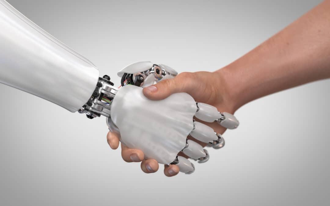 A robotic hand shaking a human hand