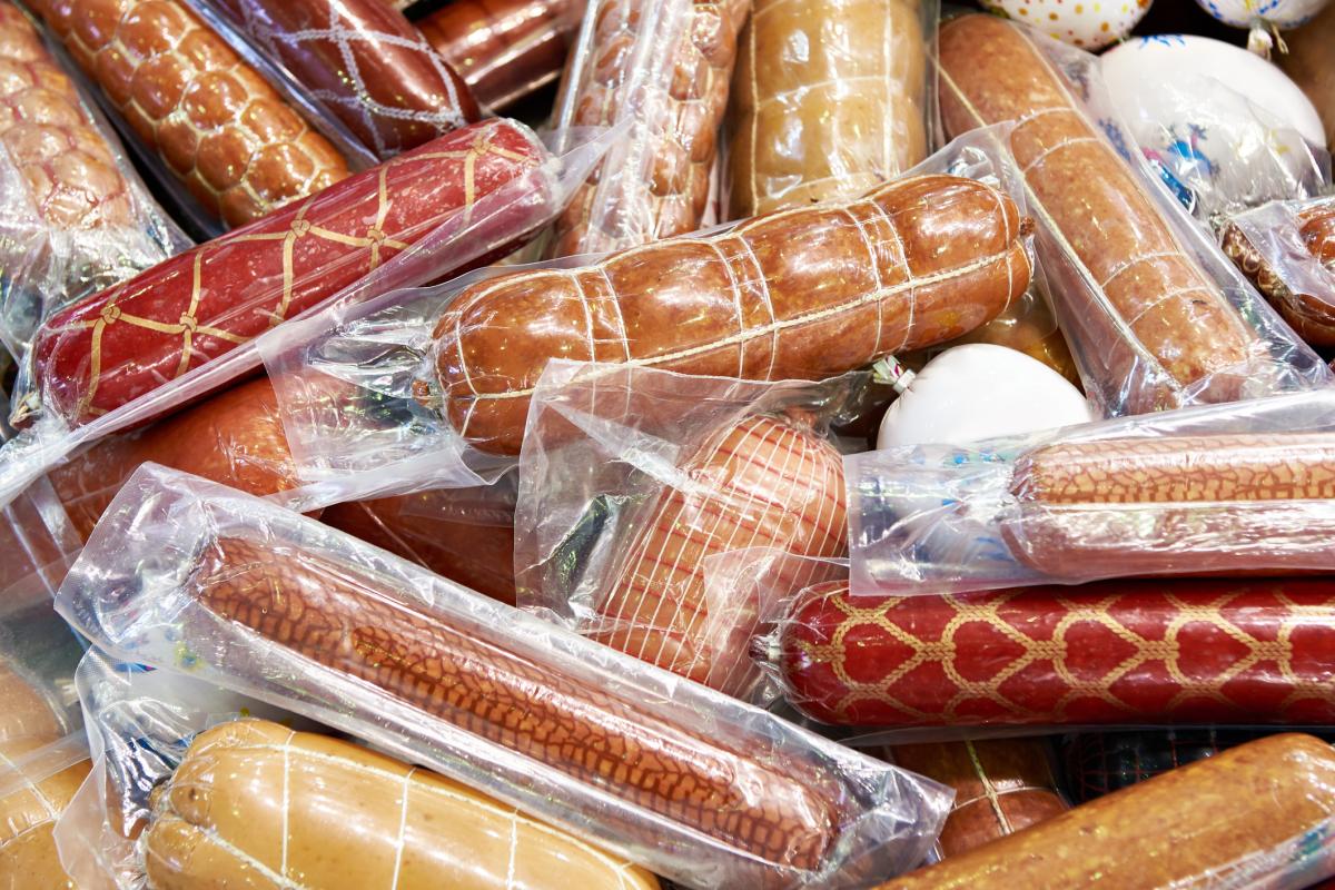 Sausages wrapped in product packaging materials